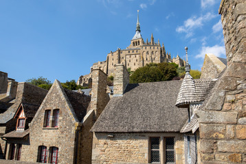 Fototapeta premium Ancient buildings of the old town on the famous Mont Saint Michel island in France