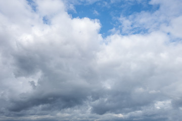 light fluffy clouds on a bright blue sky