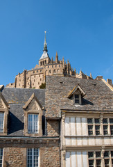 Naklejka premium Ancient buildings of the old town on the famous Mont Saint Michel island in France