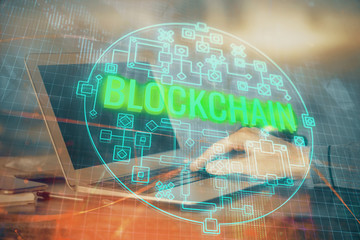 Blockchain theme hud with businessman working on computer on background. Concept of crypto chain....