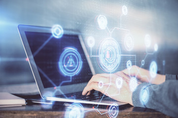 A man working on Laptop with technology theme drawing. Concept of big data. Double exposure.