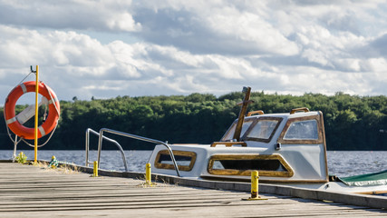 SUMMER ON LAKE - Old boat at the pier  © Wojciech Wrzesień