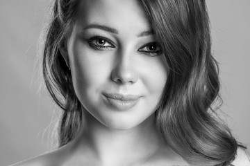 portrait of a beautiful young woman close-up. the face of an attractive girl. black and white, monochrome photography