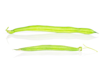 Group of two whole fresh green bean one is above of the other isolated on white background
