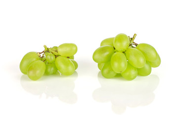 Two small bunches of fresh green grape isolated on white background