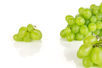 Lot of whole fresh green grape isolated on white background