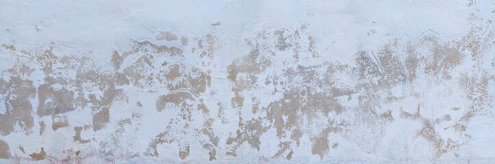 Panorama einer abstrakten hellen Wandstruktur mit stark verwittertem Verputz