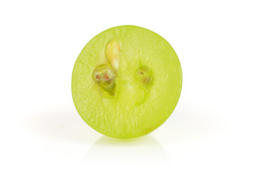 One half of fresh green grape with seed isolated on white background
