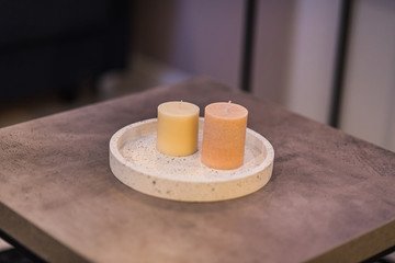 Candles in a round ceramic tray