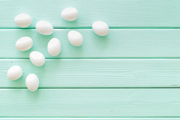 Farm products with eggs on mint green wooden background top view mock up