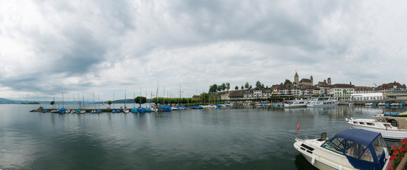 harbor and city of Rapperswil with the historic castle and church panorama