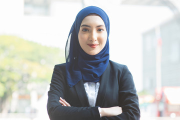 Muslim woman in business suit.