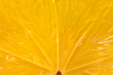 Heart of orange fruit extra close-up in a cut.