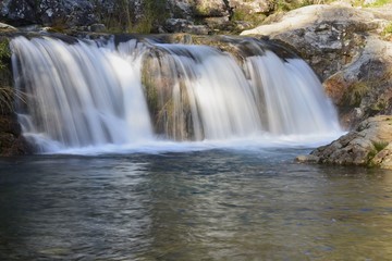 Fototapeta na wymiar Waterfalls; The beauty of nature forces on mountain