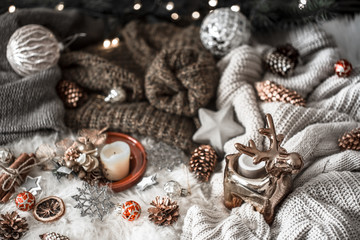 Christmas background. knitted sweater and christmas decoration on a light background, top view. Still life