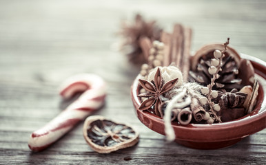 Christmas still life with dried oranges,cinnamon sticks and anise star on plate