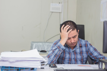 Obraz premium A man working hard burn out syndrome