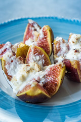 Figs with Goat Cream Cheese, Honey and Hazelnut Powder.