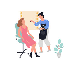 Make up artist standing and holding palette and cosmetic