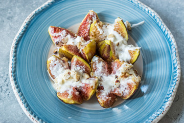 Figs with Goat Cream Cheese, Honey and Hazelnut Powder.