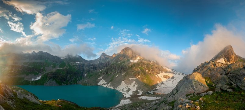 Alpine lake Klukhor with beautiful water and surrounded by mountains in the Caucasus in the Karachay-Cherkess Republic © Ambartsumian