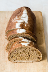 Einkorn Wheat Bread with Slices on Wooden Board.