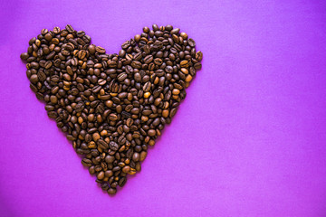 Heart coffee of coffee beans on burlap texture