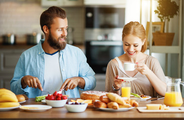 Obraz na płótnie Canvas family happy couple have Breakfast in kitchen in morning