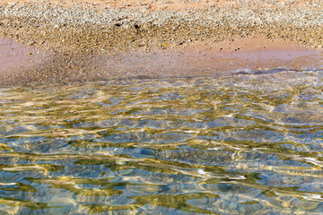 Pure calm sea water and coastline as background