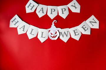 Happy Halloween written on red Background with pumpkin, copy space