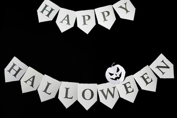 Happy Halloween written on black Background with pumpkin, copy space