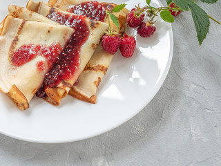 Homemade pancakes with raspberry jam. Copy space.
