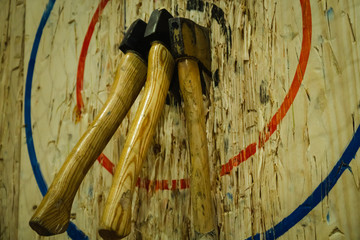 Axe stick on the bullseye target in Throwing axe new trend sport - Powered by Adobe