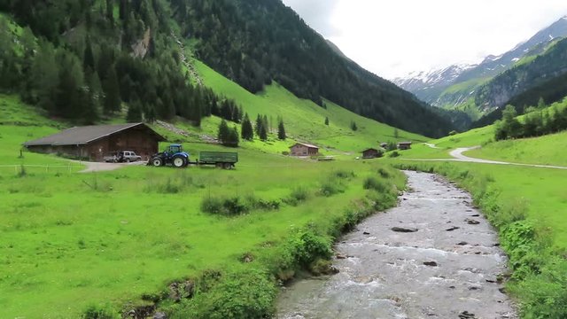 Old wooden barn on Schoenachtal valley in Tirol Austria. Hiking trail through the valley.