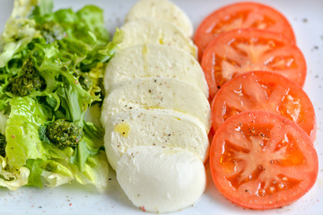 lad with tomatoes and cucumbers