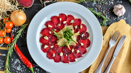 beetroot carpaccio on a white plate