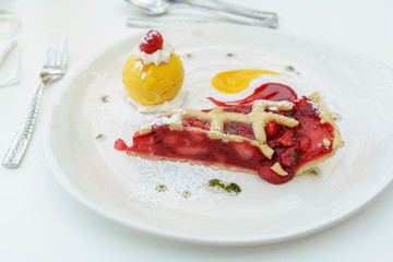 Homemade warm apple and damson plum tart and mango sorbet served in restaurant in Scotland