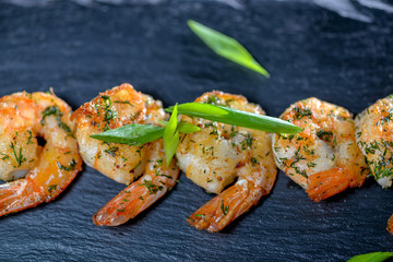 large shrimp on black slate