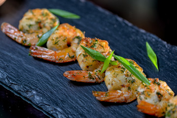 large shrimp on black slate