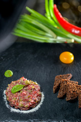 veal tartare on black slate