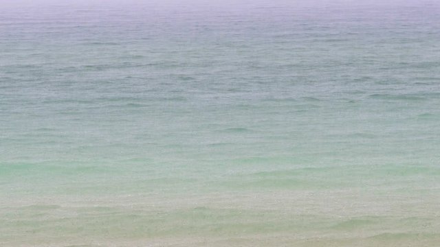 Drops of rain fall into the sea. Weather.
