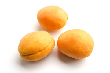 Isolated apricots. Fresh whole apricot fruit with leaf and half isolated on white background with clipping path