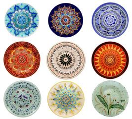 Set of decorative ceramic dishes hand-painted with acrylic paints floral pattern isolated on white background