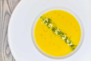yellow cream soup in a round plate