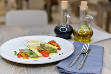 ravioli with sun-dried tomatoes and cheese on a plate