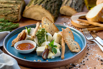 cheese slices on a beautiful blue plate with food styling