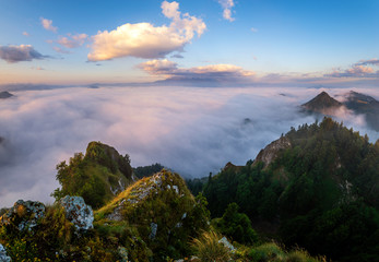 panorama of mountains and valleys covered with morning fog in the beautiful , spectacular sunrise from the top-Pieniny mountains, Three Crowns, Poland