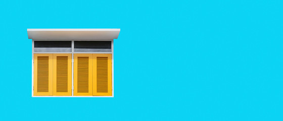 Vintage yellow wood window on blue concrete wall background with copy space.