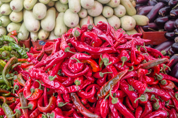 Heap of ripe big red peppers