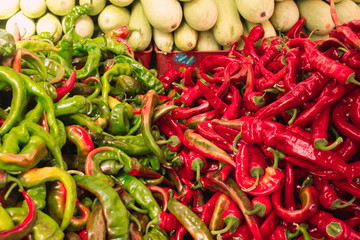 red and green peppers on a local market counter